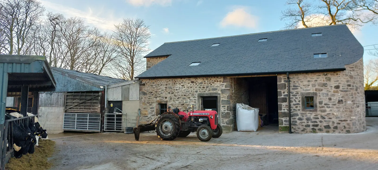 Restored stone barn with a new slate roof