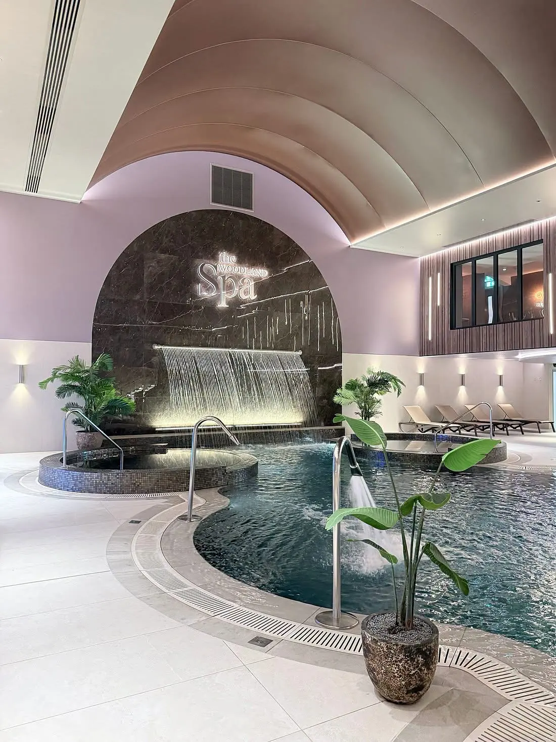 The Woodland Spa, pool and marble waterfall wall