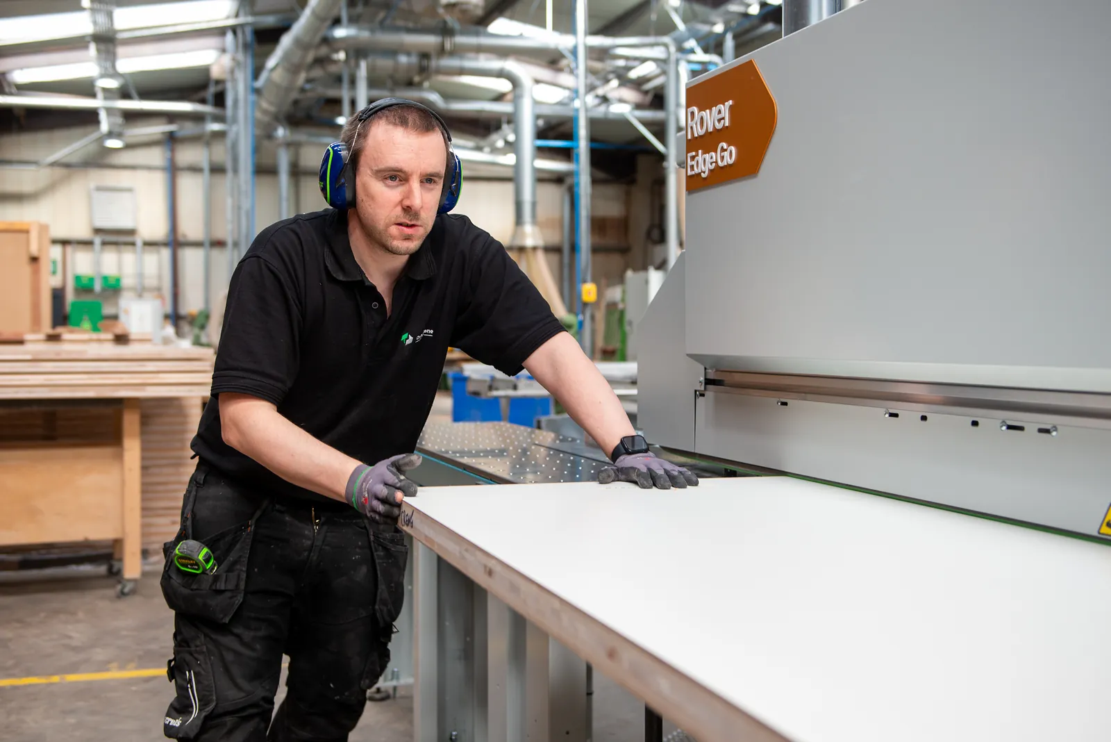 Feeding a panel through the edgebander